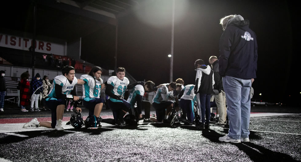 Football team praying