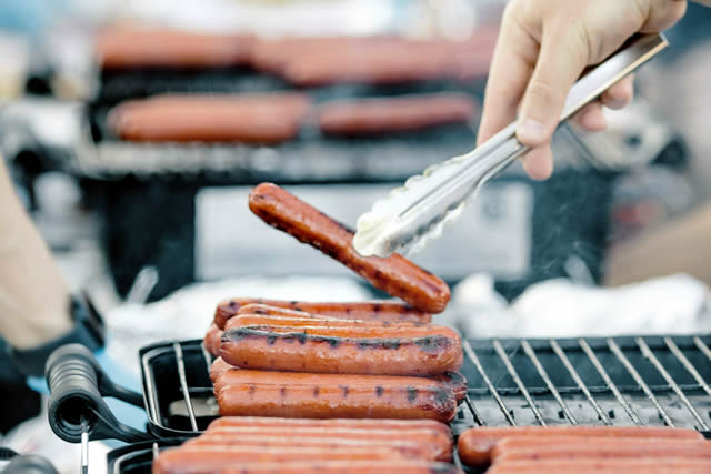 Hot dogs on a grill