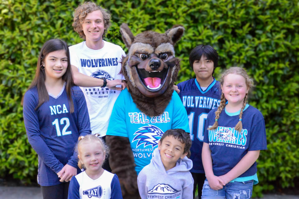 spirit-store Students and mascot in Wolverine spirit-wear