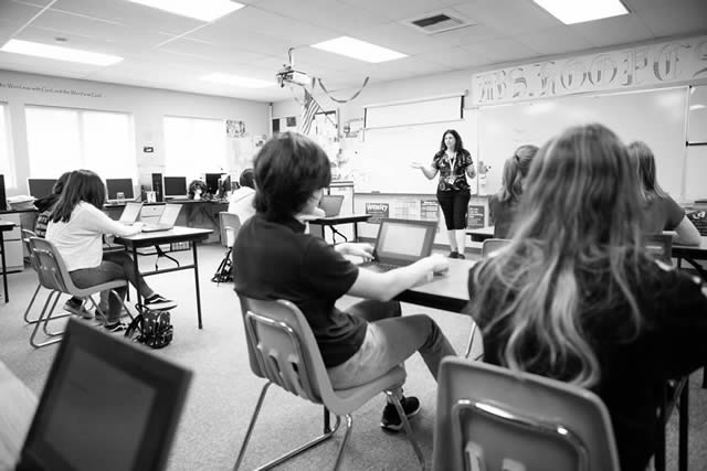 High school classroom with students and teacher